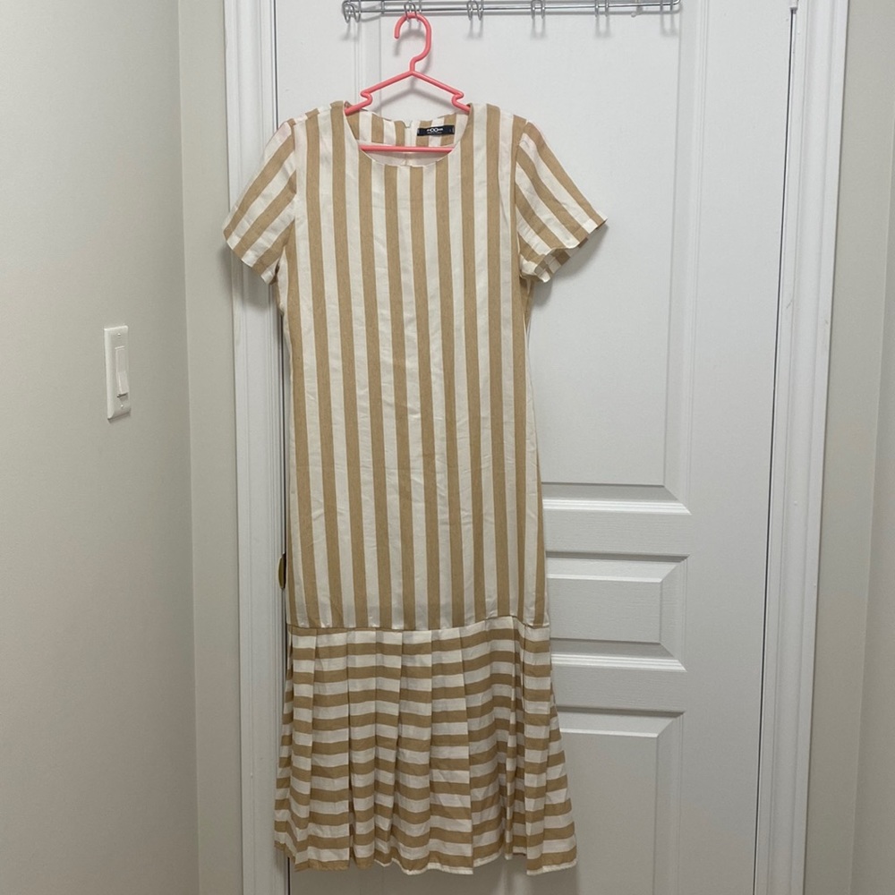 A long white and cream short sleeved summer dress